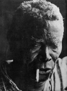 Mestre Irineu, a Black man from Brazil who founded the Santo Daime religion, smoking tobacco, 1968.