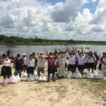 Kevin (centre) receiving supplies with his Kukama Community,2020, Photo by Emily Sinclair.