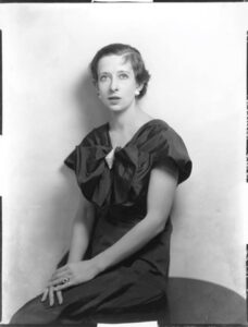 Maria Nys Huxley in October 1934. She sits with her hands crossed in front on her lap.