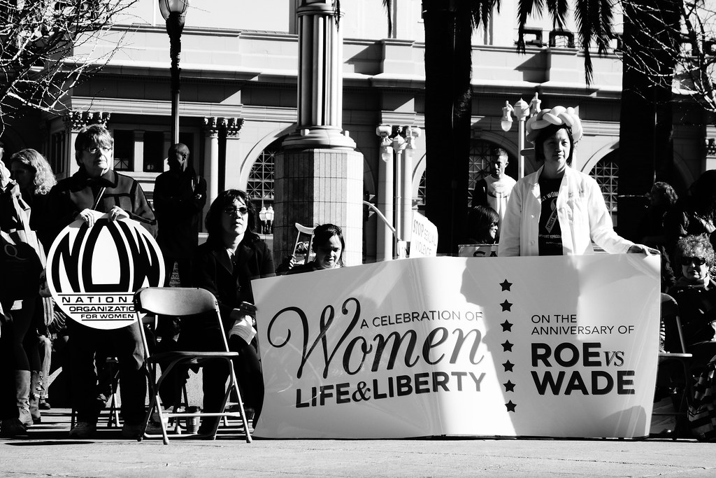 A group of women holding signs in support of women's reproductive rights at the 40 years of Roe v. Wade anniversary in San Francisco, California