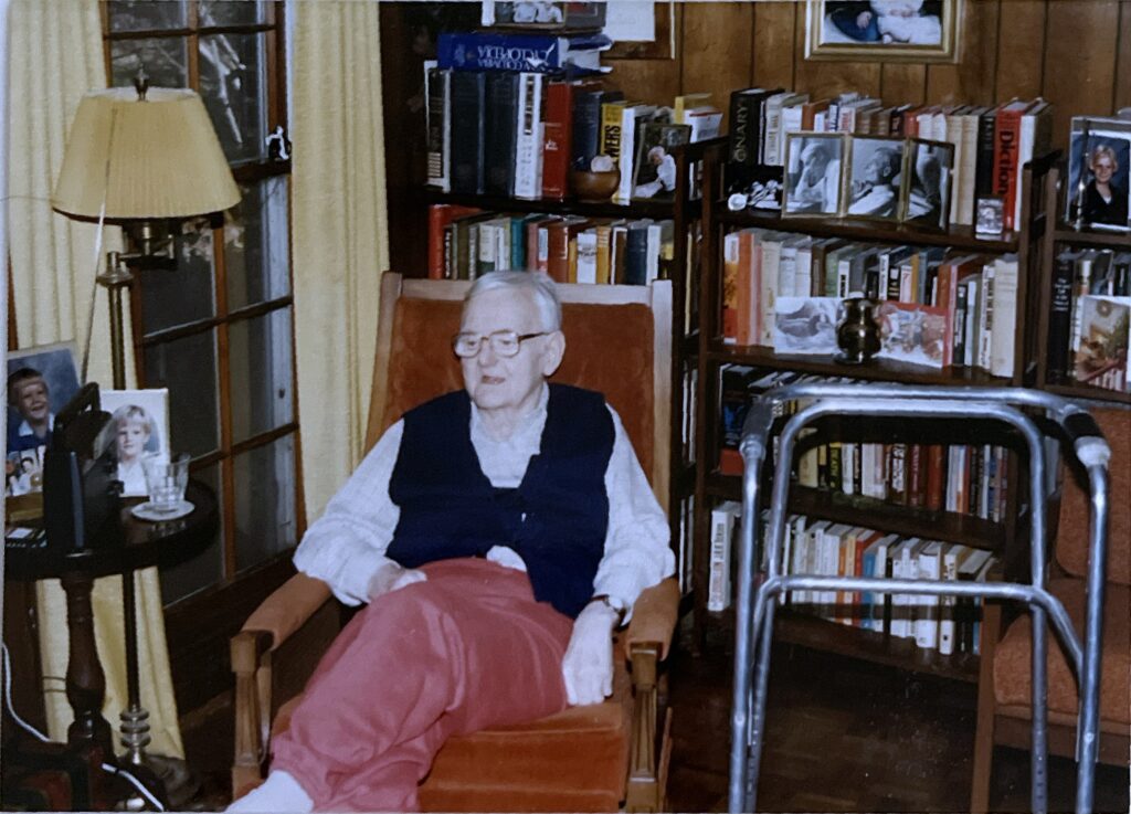 Humphry Osmond sitting in a chair during a family visit in the late 1990s.