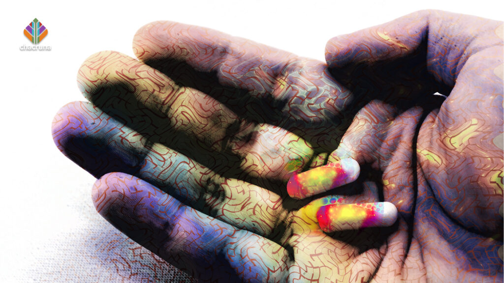 A hand holding pills representing the ayahuasca pills developed by Canadian company, Filament Health
