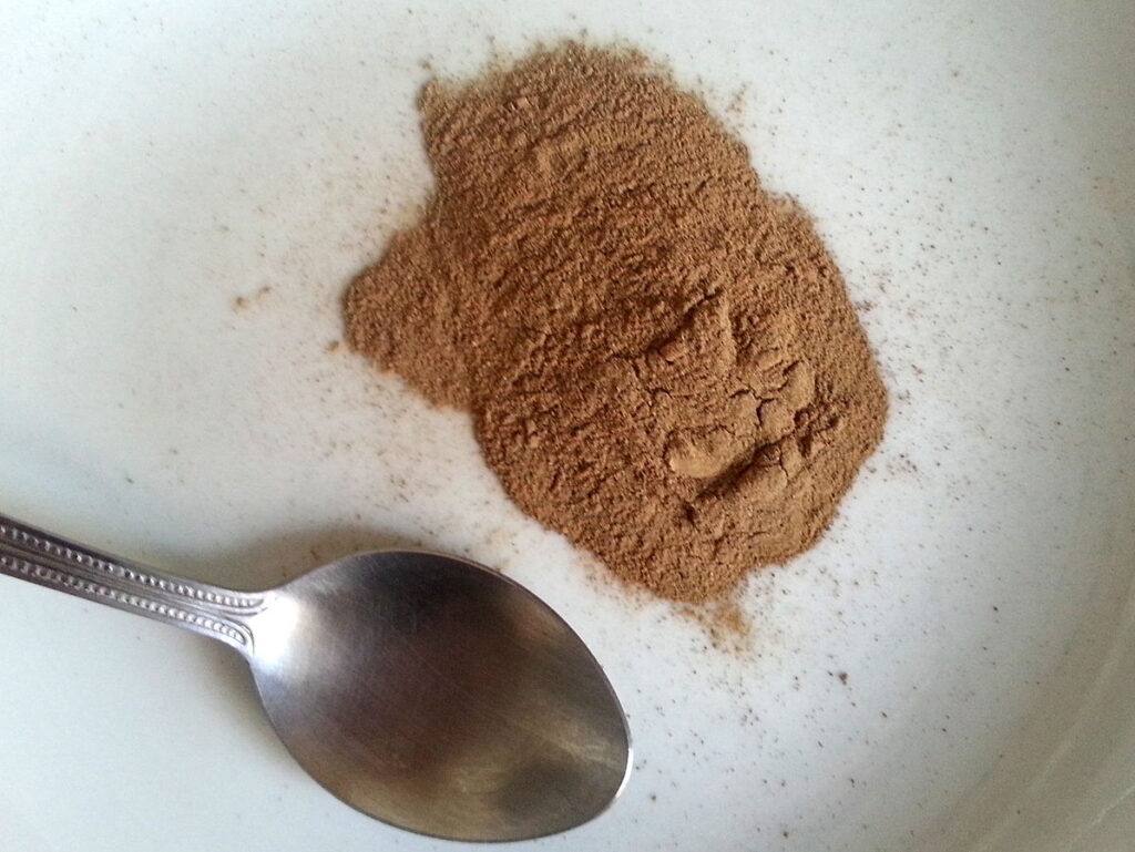 A pile of ibogaine powder next to a spoon, ready for consumption.