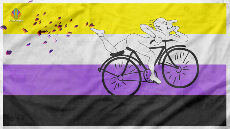 A white figure with a smile on their face rides a black bicycle with the non-binary flag in the background